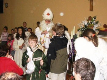 St. Nicholas giving presents at mass