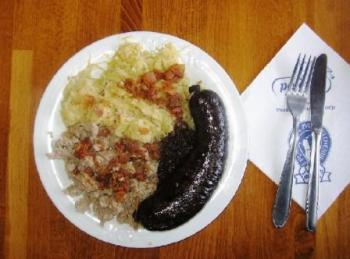 blood sausage with sour cabbage and buckwheat mush covered with cracklings