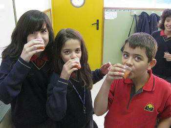 Mireia, Cristina and Luis drinking gazpacho 